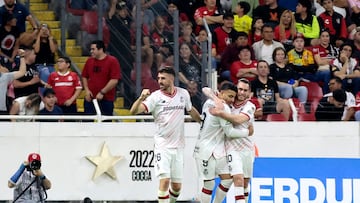 Toluca's Portuguese forward #26 Paulinho (L) celebrates next to teammates forward #09 Alexis Vega and midfielder #10 Jesus Angulo after scoring his team's third goal during the Liga MX Clausura football match between Atlas and Toluca at the Jalisco Stadium in Guadalajara, Jalisco state, Mexico on April 12, 2025. (Photo by Ulises Ruiz / AFP)