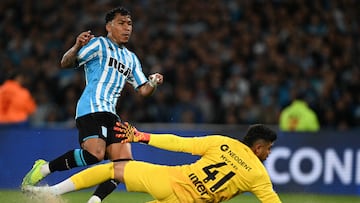 Racing's Colombian forward Roger Martinez (L) scores his team's third goal during the Copa Sudamericana quarter-final first leg football match between Argentina's Racing and Brazil's Athletico Paranaense at the Presidente Peron stadium in Avellaneda, Buenos Aires province, Argentina, on September 26, 2024. (Photo by Luis ROBAYO / AFP)
